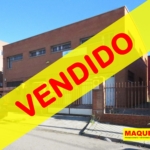 Fachada de la nave industrial en calle Electricidad de Leganés - Polígono San José de Valederas en Alcorcón con etiqueta de VENDIDO