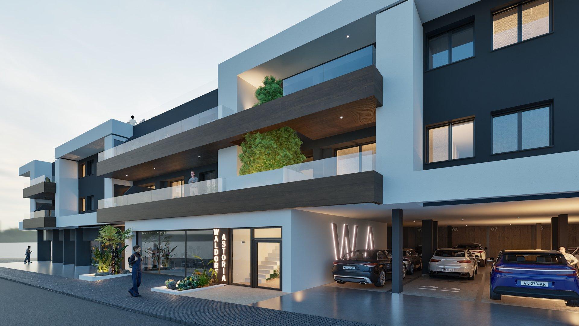 Modern four-story building with glass balconies, dark and white façade, and a ground-floor entrance flanked by plants and signage, with several parked cars nearby