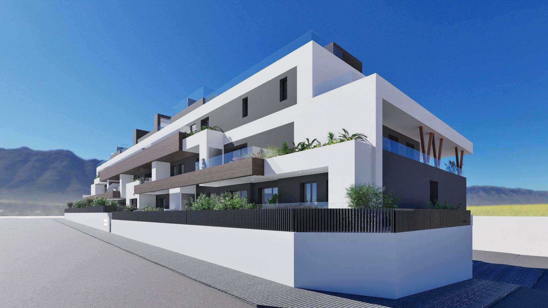 Modern white-gray apartment building with glass balconies and greenery under a clear blue sky.