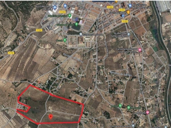 Satellite map highlighting a land parcel outlined in red with a pin marking its location in the southern area.