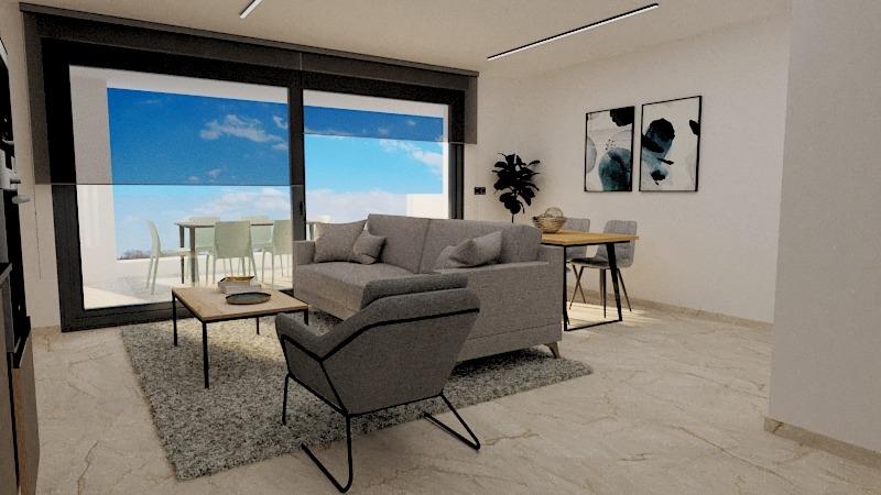 Modern living room with gray sofa, armchair, and coffee table on a rug, overlooking a balcony with blue sky.
