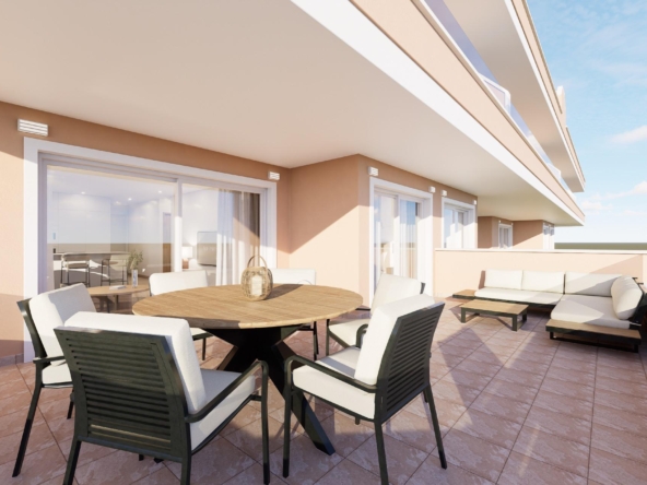 Sunlit rooftop terrace of a modern apartment with a round wooden table, white-cushioned chairs, and beige walls under a blue sky.