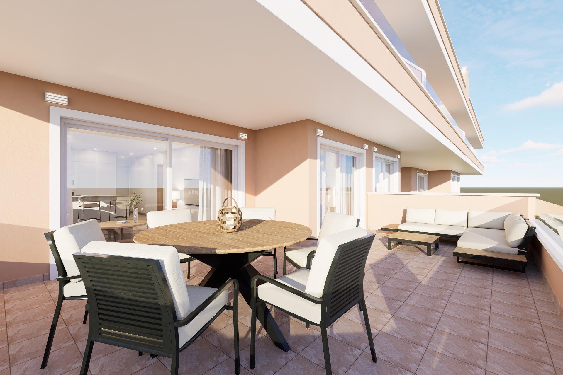 Sunlit rooftop terrace of a modern apartment with a round wooden table, white-cushioned chairs, and beige walls under a blue sky.