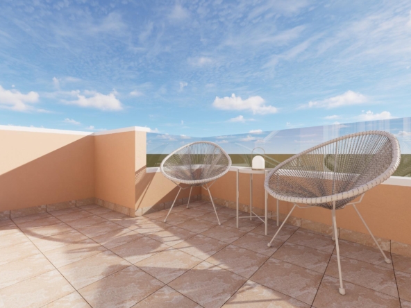 Terrace with peach walls, two woven Acapulco chairs and a small table on tiled floor under a blue sky with clouds.
