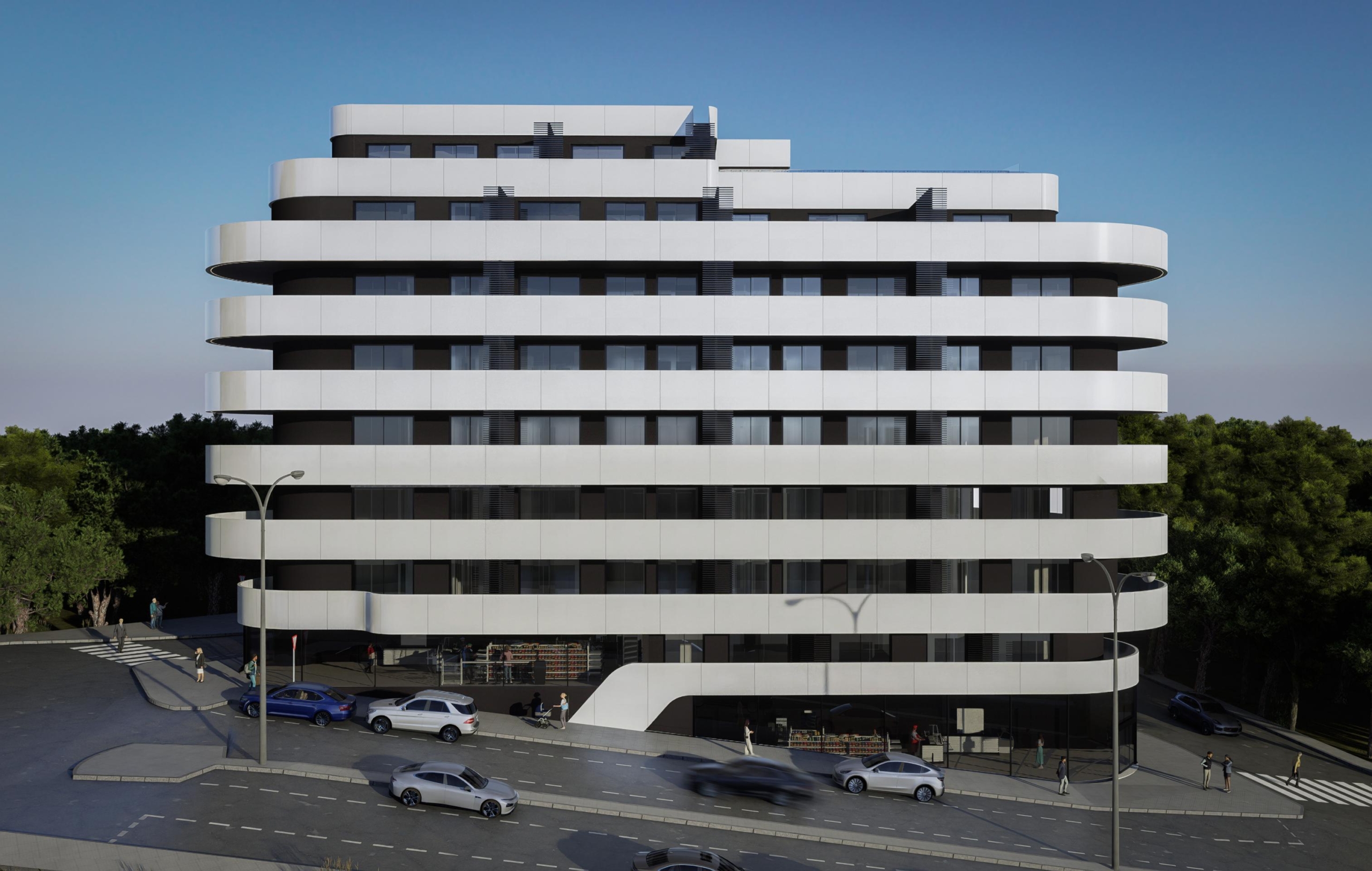 White, multi-tiered building with curved balconies stacked in horizontal bands against a blue sky; tree-lined street and pedestrians in front.