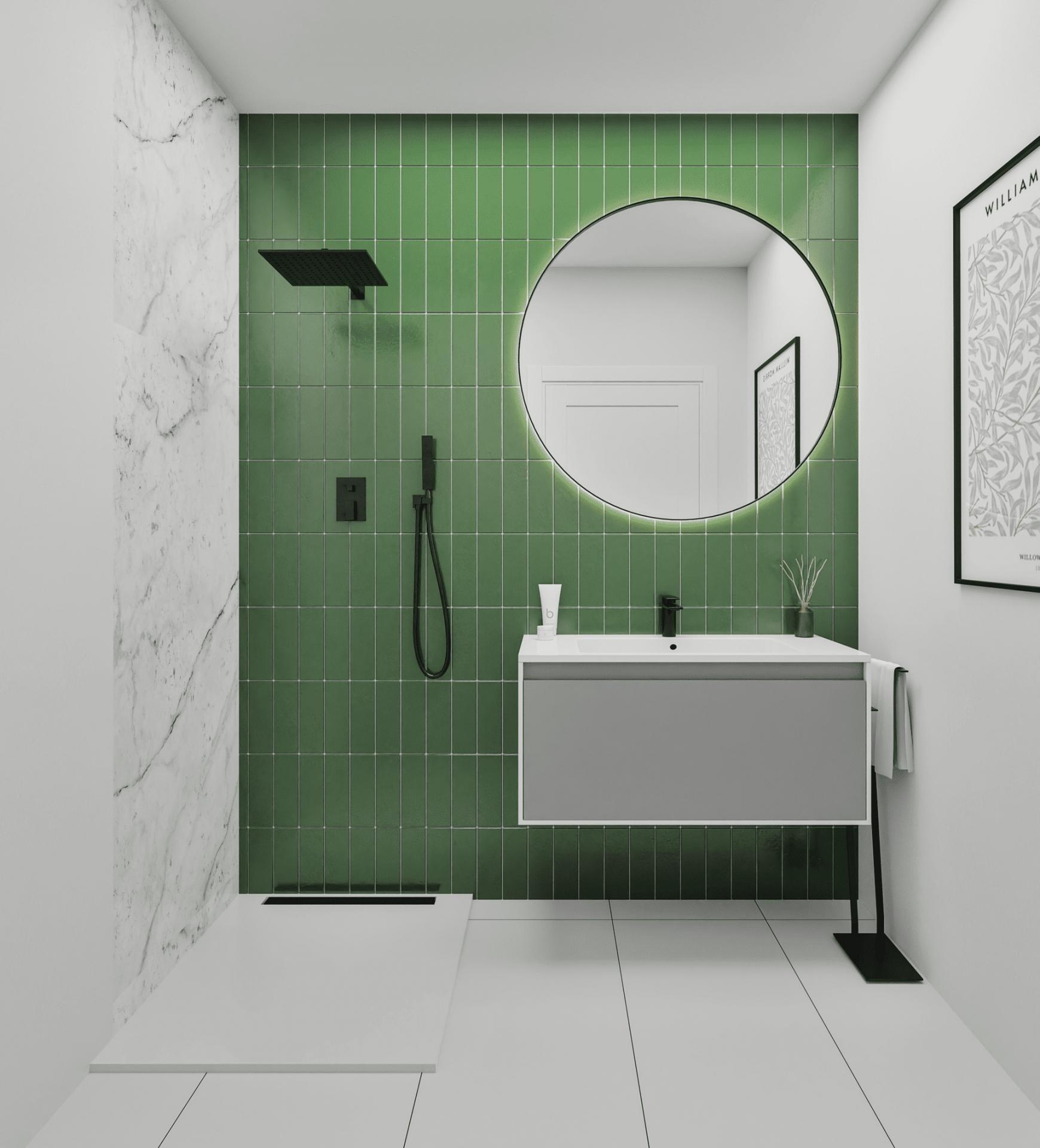 Modern bathroom with a green tiled wall, round mirror, and white vanity with black fixtures.