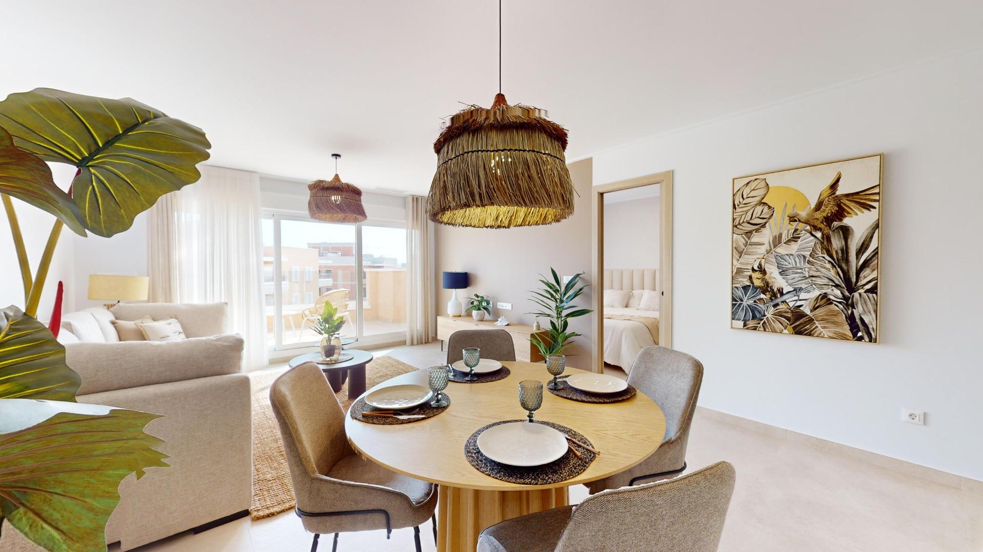 Bright open-plan living and dining area with a round table set for six, woven pendant lights, and a large tropical plant in the foreground.