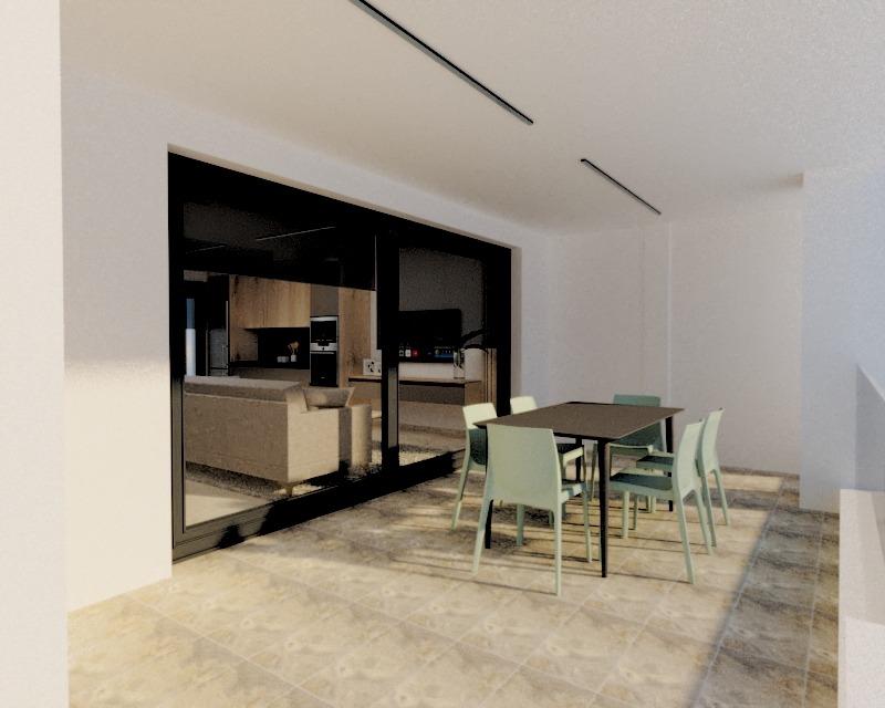 Modern indoor dining area with six light-green chairs around a dark rectangular table, glass doors opening to a living room visible beyond.