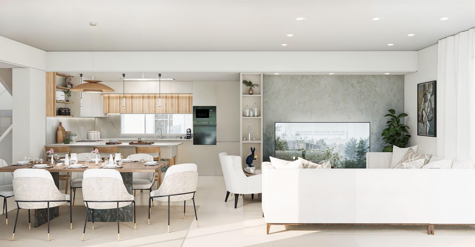 Bright open-plan kitchen and dining area with white cabinets, wooden accents, a long table set for eight, and a living area with white seating.