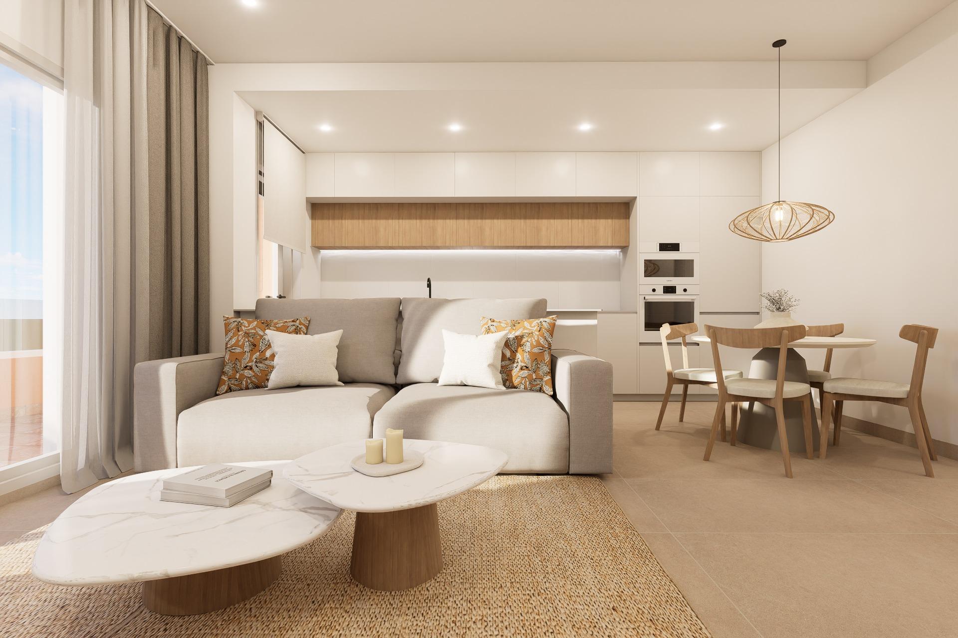 Open-plan living area with beige sofa, white cabinetry, and a round dining table by a hanging woven pendant light.