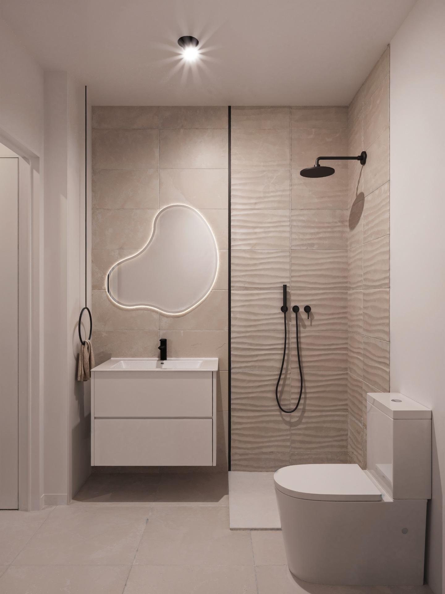 Contemporary bathroom featuring a walk-in shower with a black ceiling-facing showerhead, a white vanity with integrated sink, and a wall-mounted toilet.