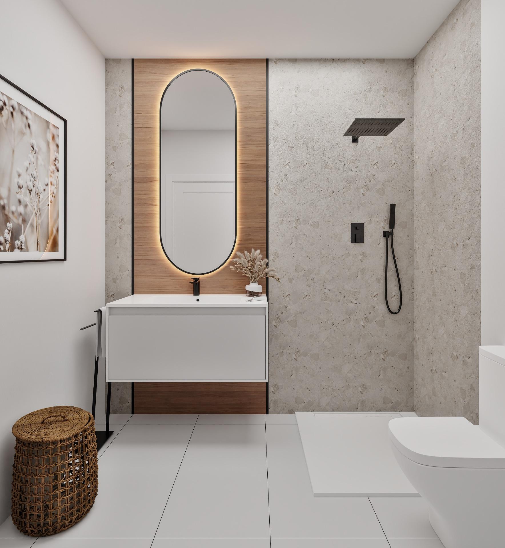 Contemporary bathroom with a white vanity, black faucet, and an oval backlit mirror set in wood panels against stone walls, and a square rain shower head to the right.