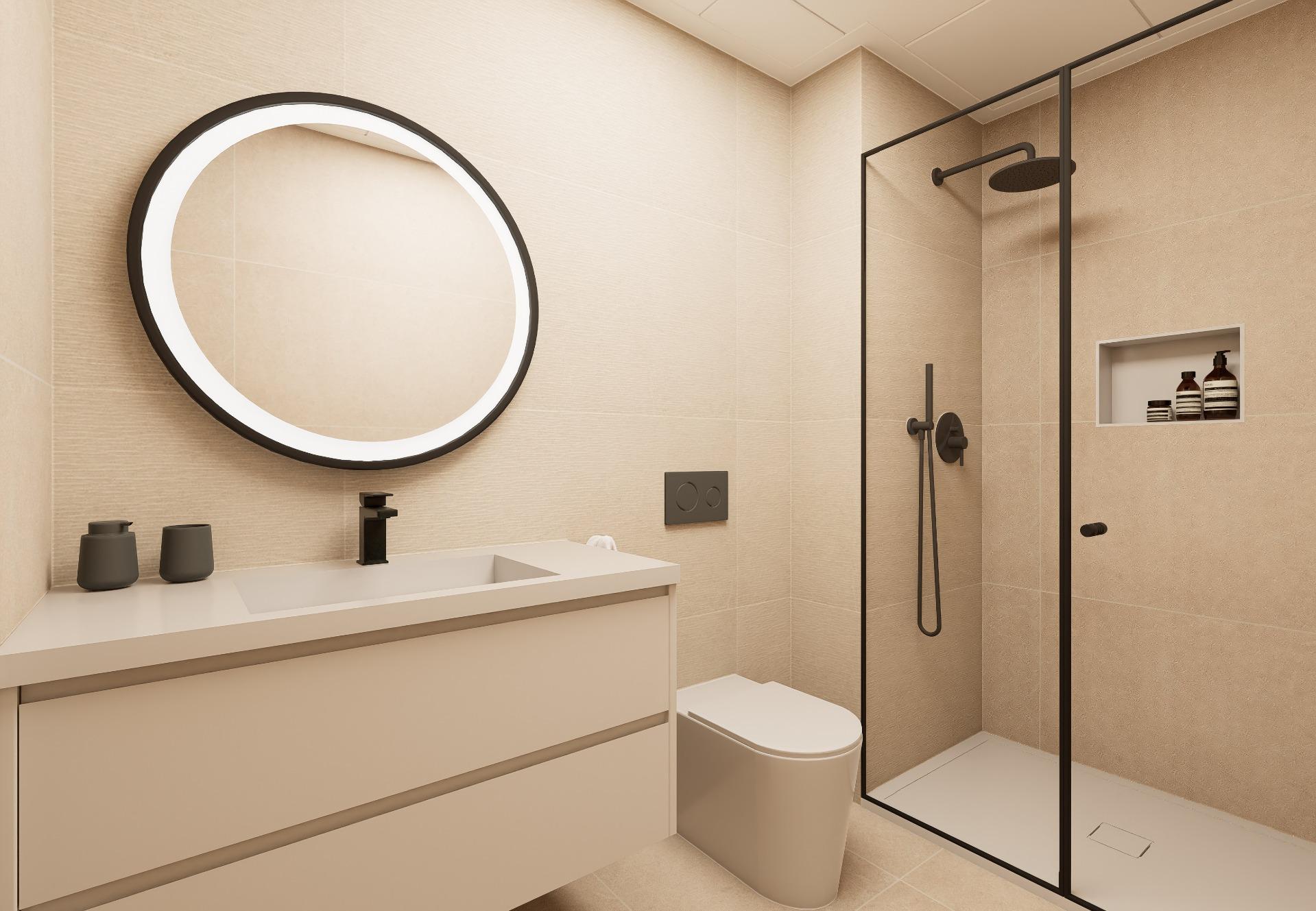 Modern beige bathroom with a circular backlit mirror above a white vanity and black faucet.