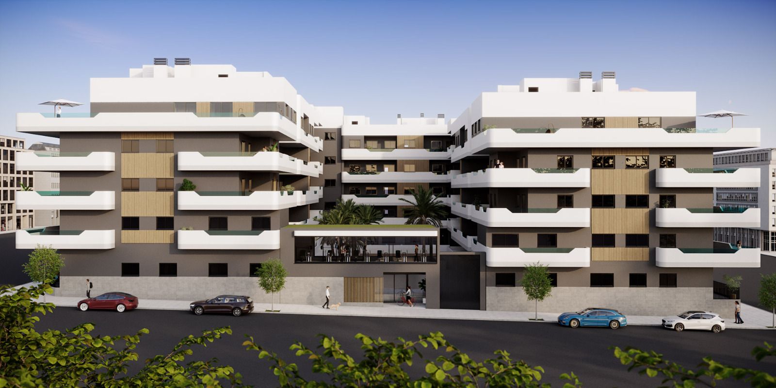 Modern multi-story residential building with white stepped balconies and beige accents, surrounding a central courtyard.