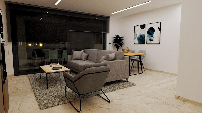 Contemporary living room with a gray sectional sofa, armchair, and wooden coffee table on a rug, facing large glass doors. At the back, a dining area and wall art create an open, neutral space.