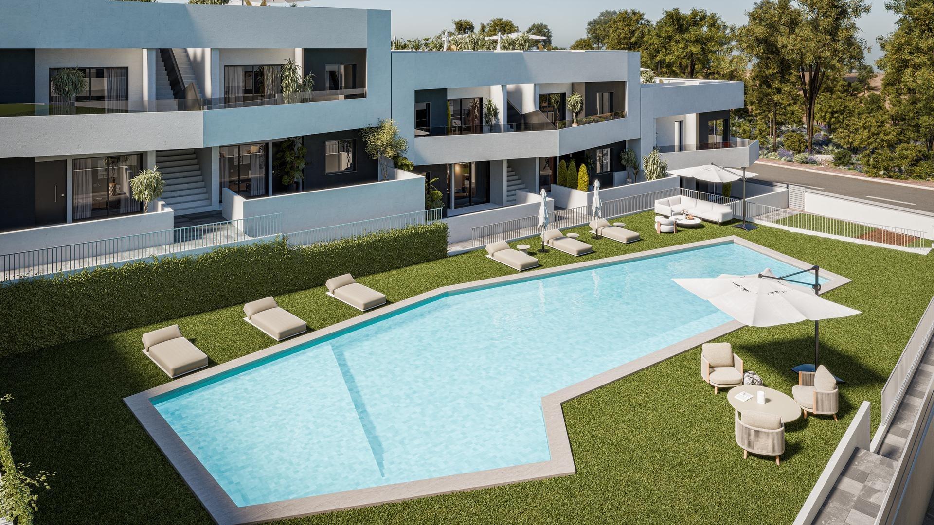 Modern apartment building with an outdoor pool area, lounge chairs, and umbrellas along the water.