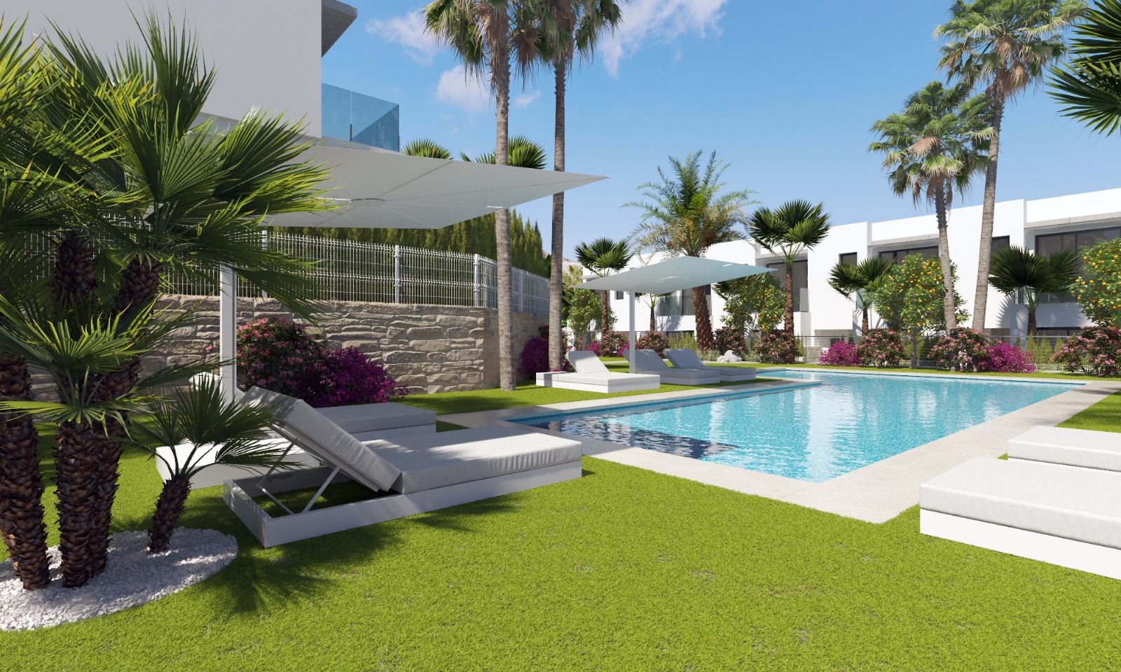 Luxury resort-style pool area with white lounge beds, palm trees, and umbrellas by modern white buildings.