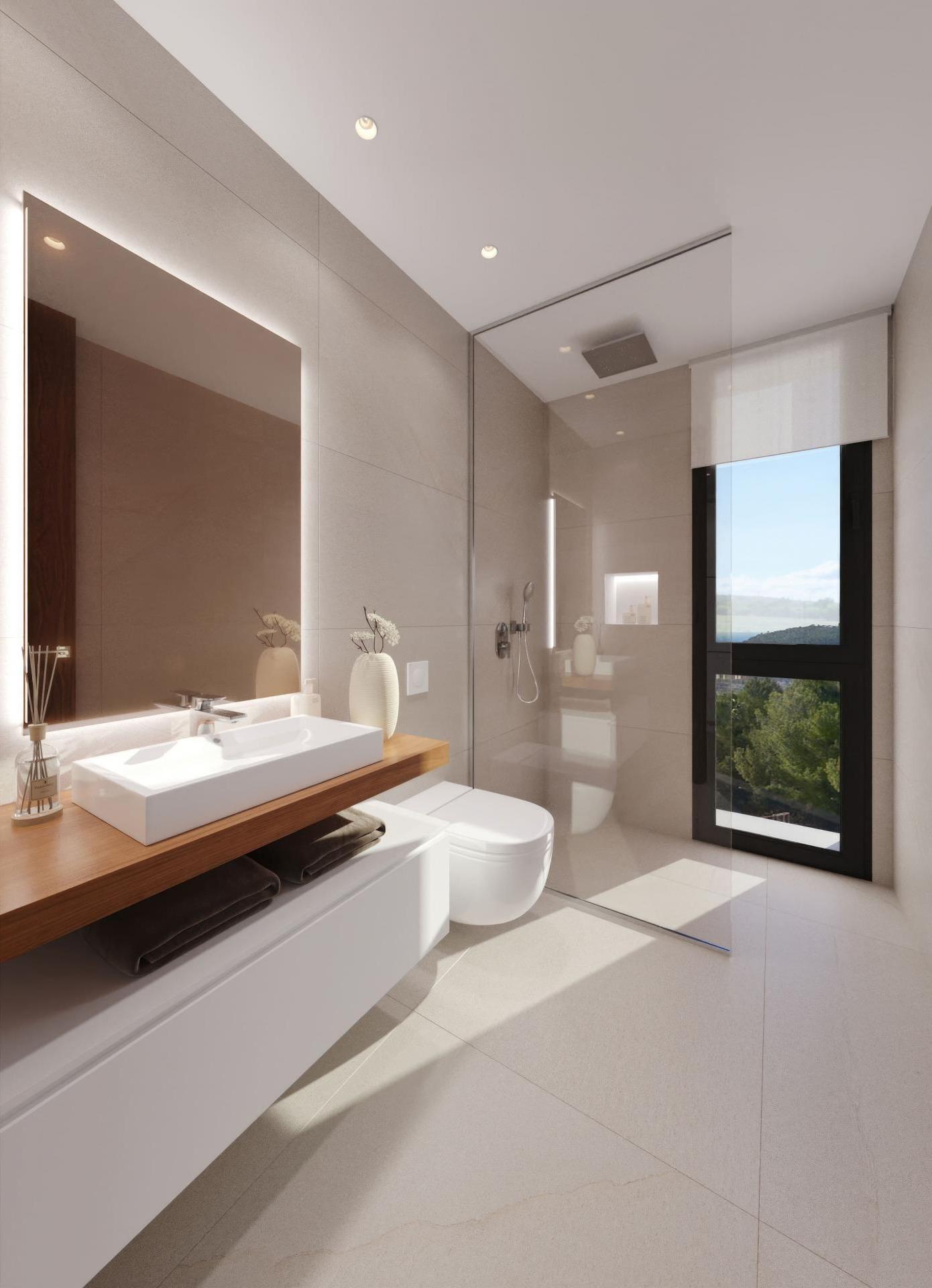 Modern minimalist bathroom with a wall-mounted white sink on a wooden countertop, backlit mirror, and glass shower enclosure.