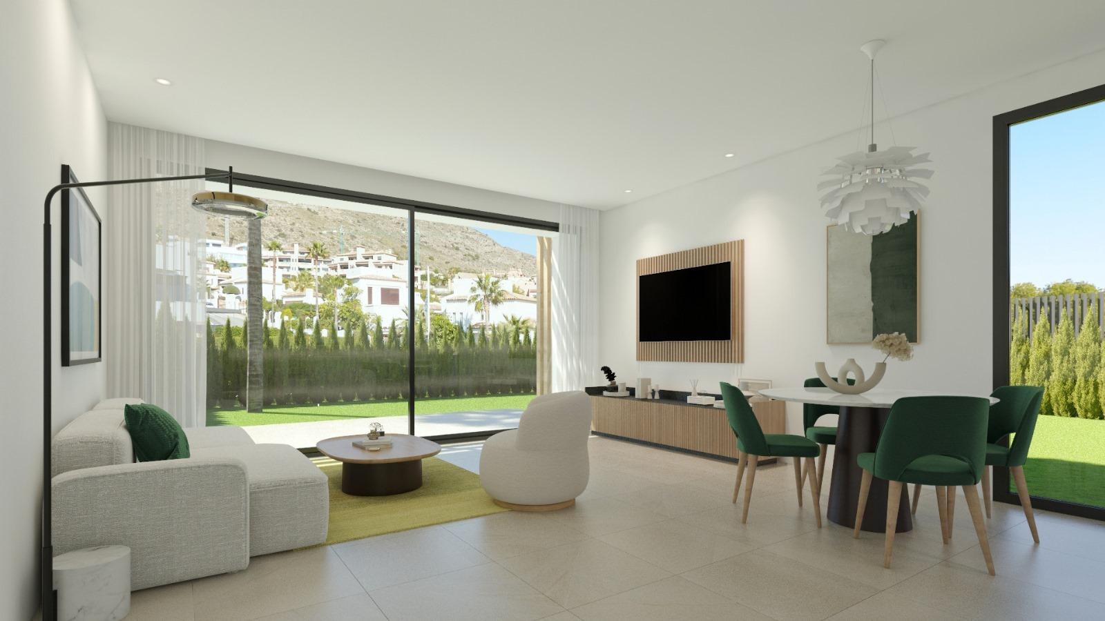 Open-concept living room with glass sliding doors to a green backyard, white sofa, and round coffee table on a yellow rug.