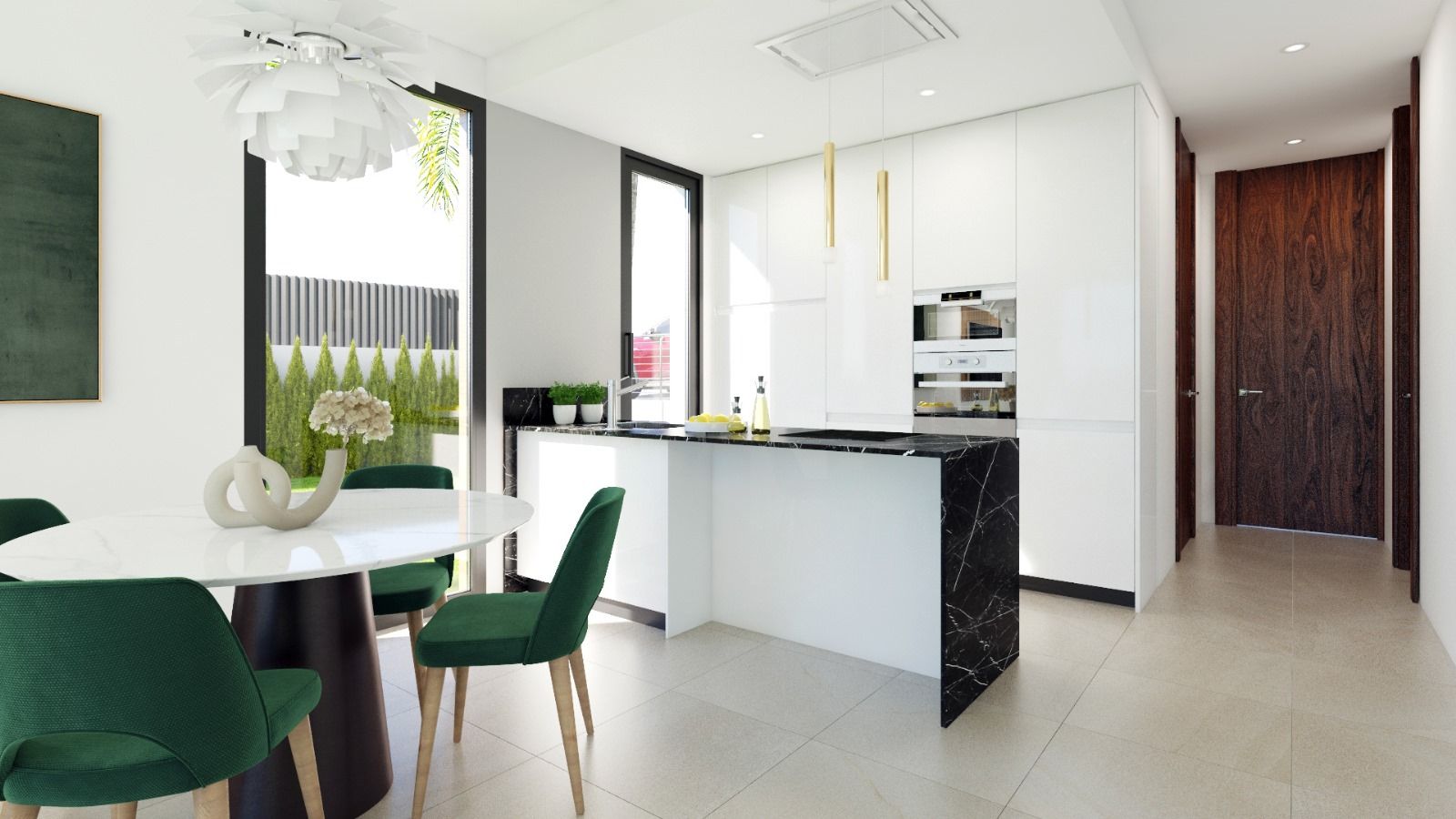 Modern kitchen and dining area with white cabinetry, black marble island, and green upholstered chairs; large windows show outdoor greenery.