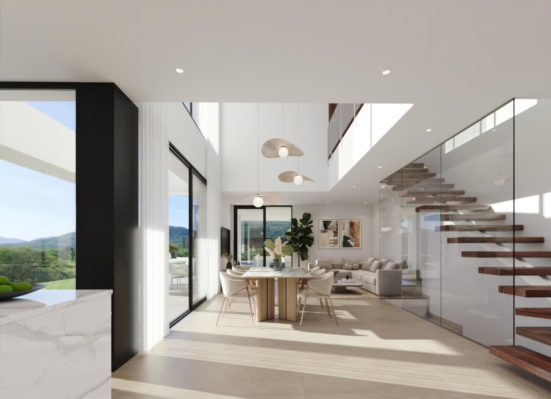 Open-plan living and dining area with a glass-paneled staircase, pendant lights, and expansive windows overlooking a landscape.