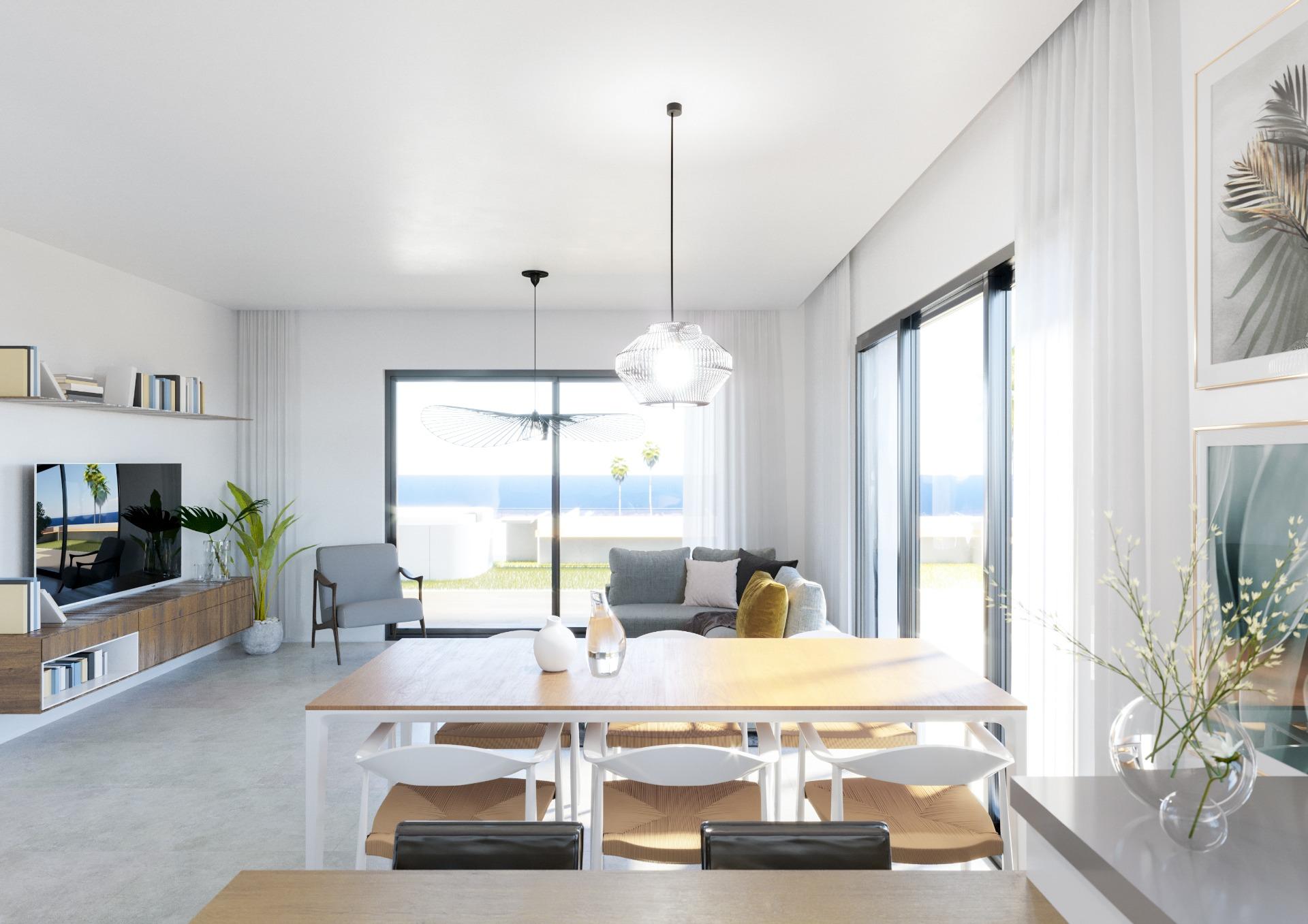 Bright open-plan living and dining area with floor-to-ceiling windows overlooking the ocean; pendant lights above the dining table.