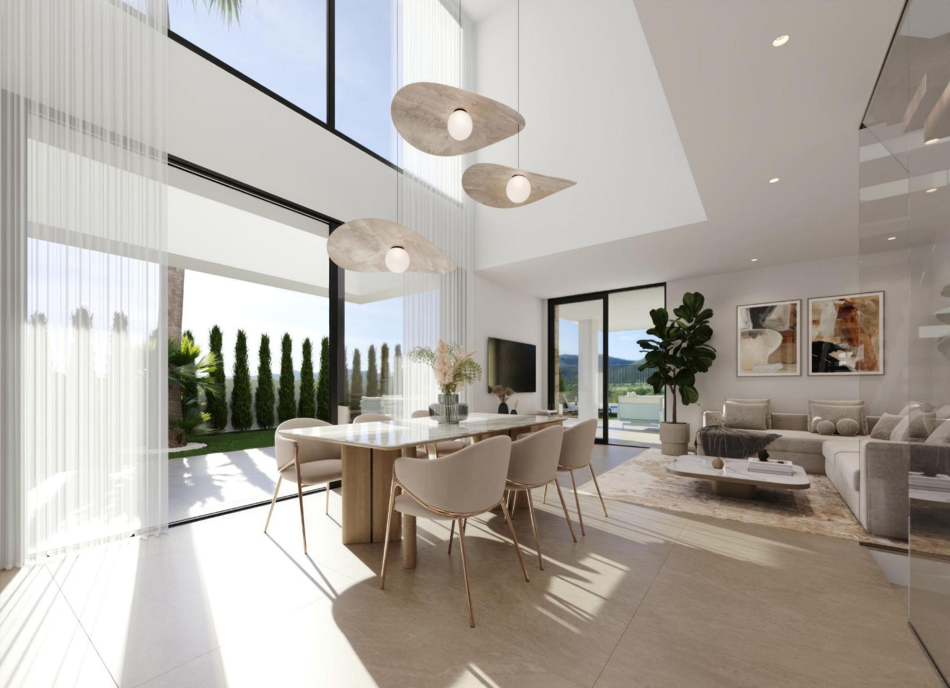 Bright, modern open-plan living and dining area with large glass walls, a wooden dining table and beige chairs, and greenery outside.